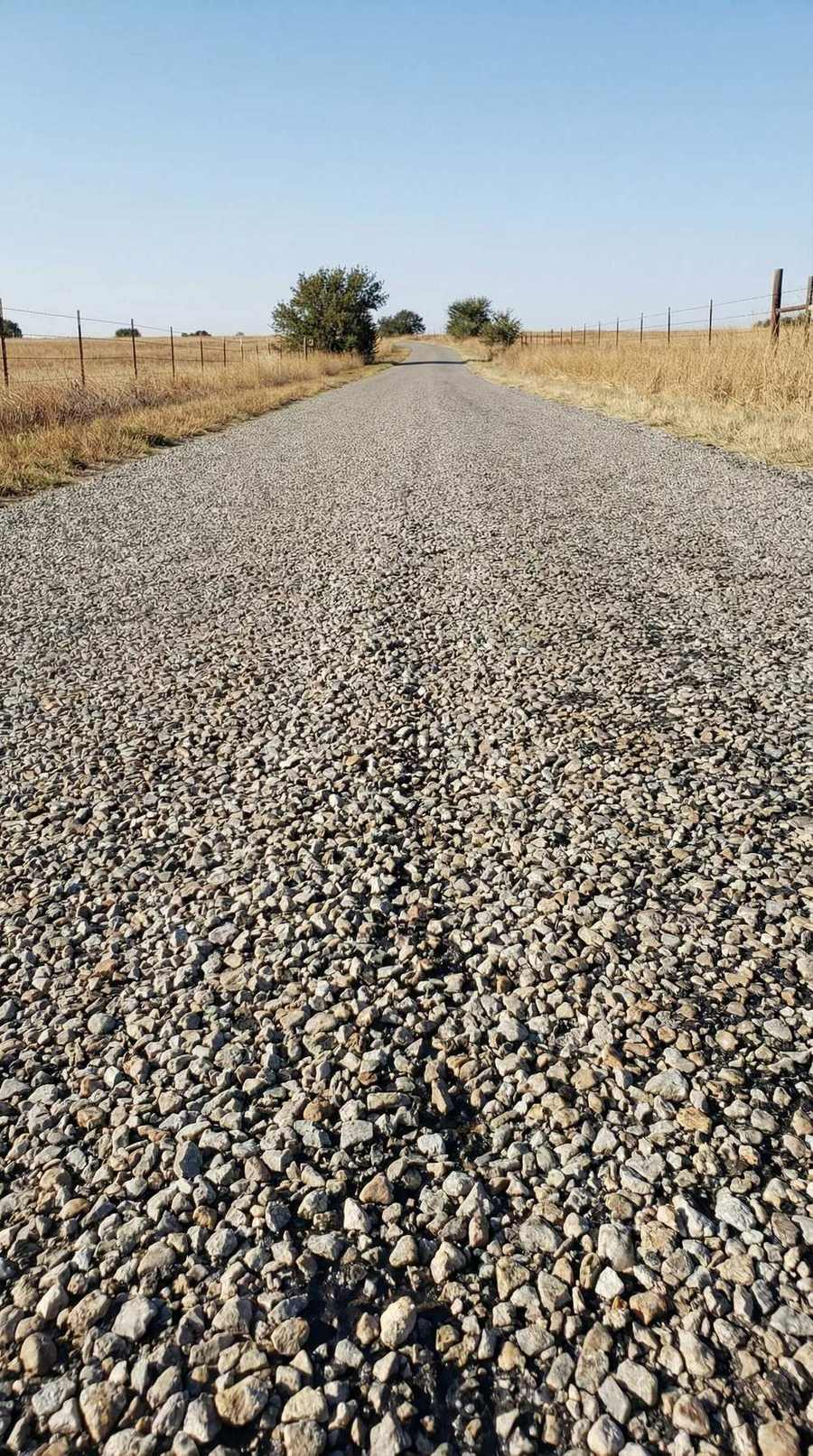 Chip seal road through dry rangeland
